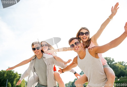 Image of smiling couple having fun in city