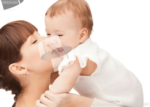 Image of happy mother kissing baby