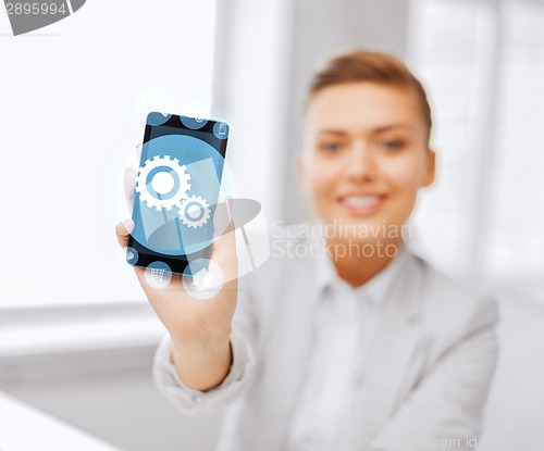 Image of close up of businesswoman with smartphone