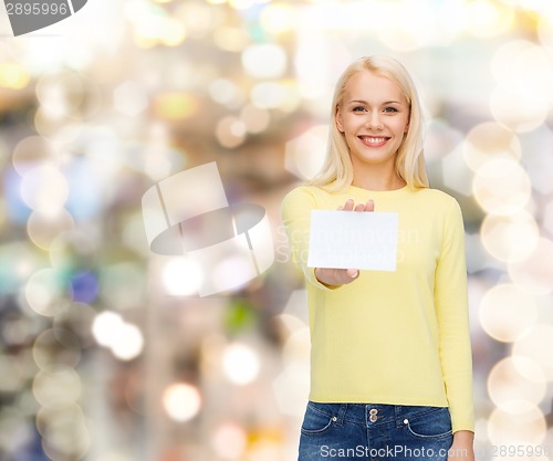 Image of smiling girl with blank business or name card