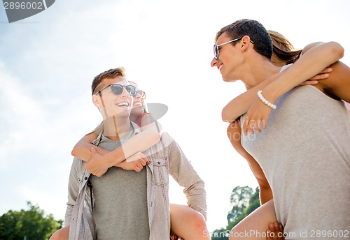 Image of smiling couple having fun in city