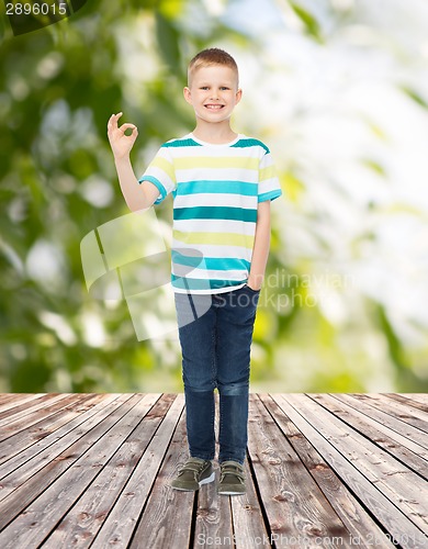 Image of smiling little boy showing ok sign