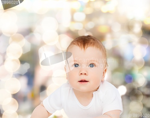 Image of smiling baby looking up