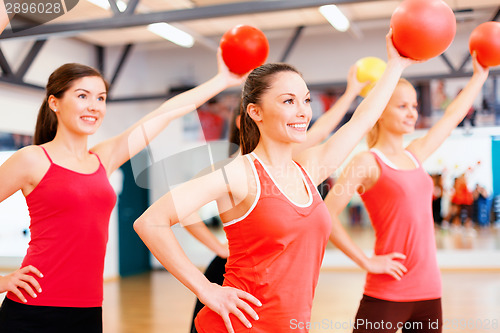 Image of group of people working out with stability balls