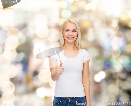 Image of woman showing thumbs up