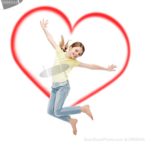 Image of smiling little girl jumping