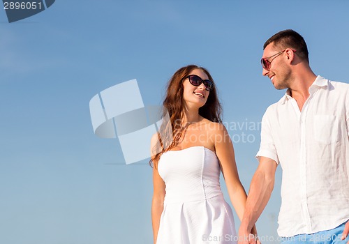 Image of smiling couple in city