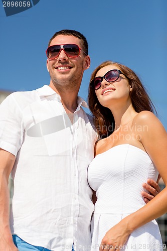 Image of smiling couple in city