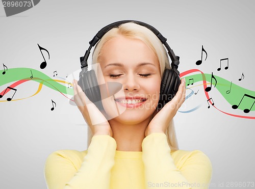 Image of smiling young woman with headphones