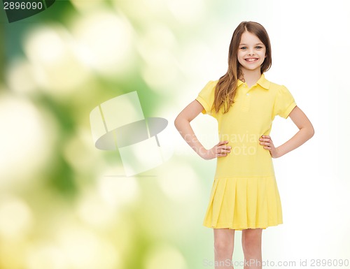 Image of smiling little girl in yellow dress