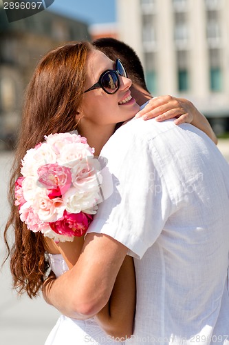 Image of smiling couple in city