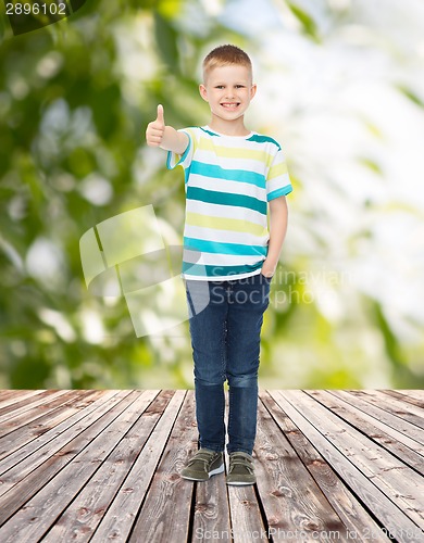 Image of smiling little boy showing thumbs up