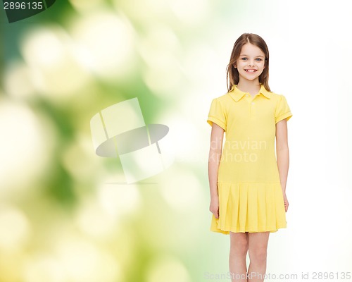 Image of smiling little girl in yellow dress