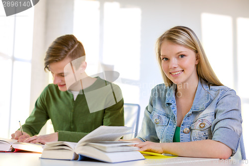 Image of students with textbooks and books at school