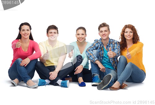 Image of group of smiling teenagers showing thumbs up