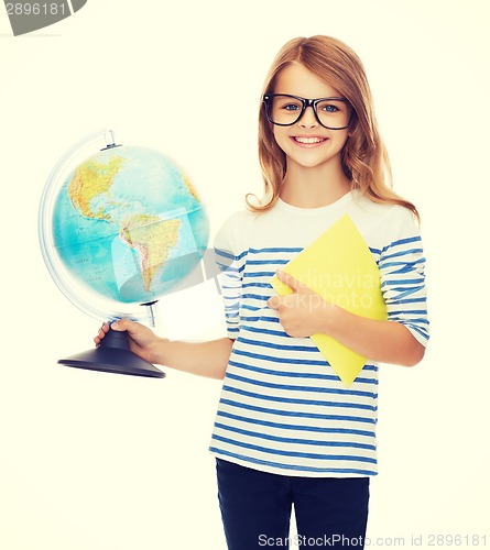 Image of smiling child with globe, notebook and eyeglasses