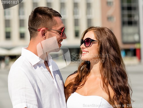 Image of smiling couple in city