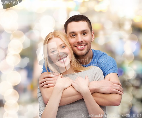 Image of smiling couple hugging