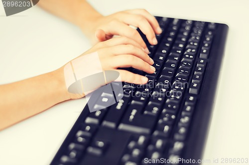 Image of student girls hands typing on keyboard