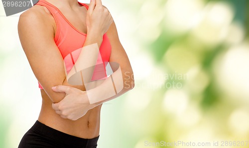 Image of sporty woman with pain in elbow