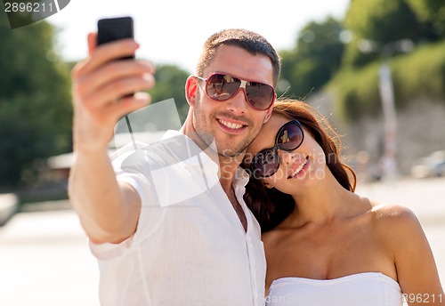 Image of smiling couple in city
