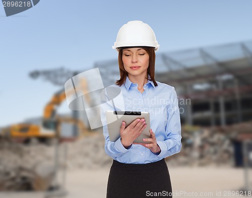 Image of businesswoman in white helmet