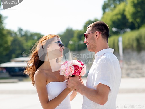 Image of smiling couple in city