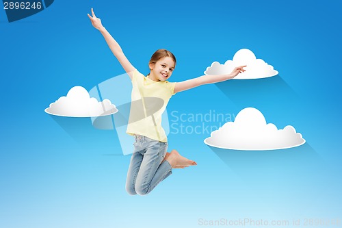 Image of smiling little girl jumping