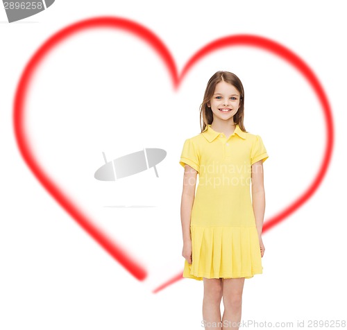 Image of smiling little girl in yellow dress