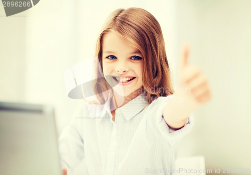 Image of girl with laptop pc at school