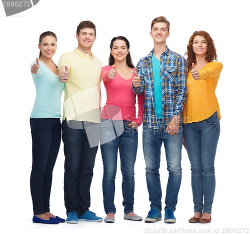 Image of group of smiling teenagers showing thumbs up