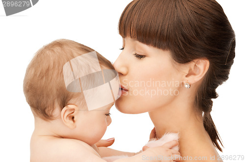 Image of happy mother kissing baby