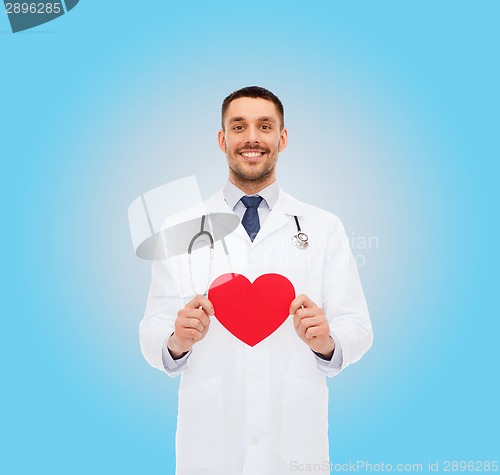 Image of smiling male doctor with red heart