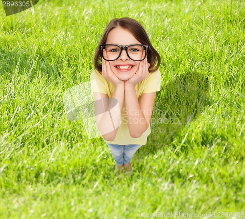 Image of smiling cute little girl in black eyeglasses