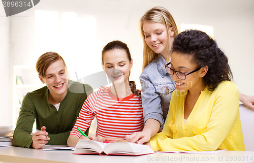 Image of students with textbooks and books at school