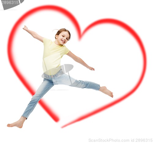 Image of smiling little girl jumping