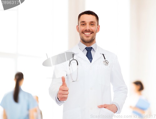 Image of smiling doctor with stethoscope showing thumbs up