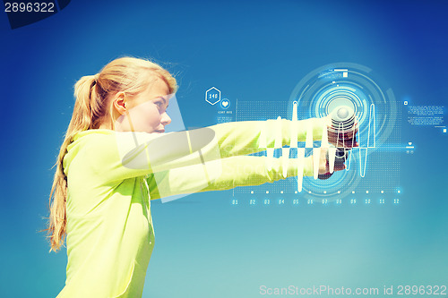 Image of sporty woman with light dumbbells outdoors