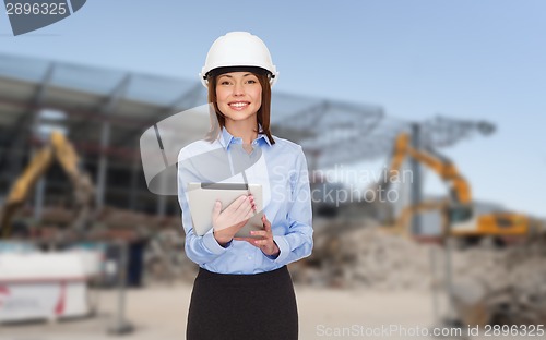 Image of businesswoman in white helmet