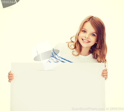 Image of smiling little girl with blank white board