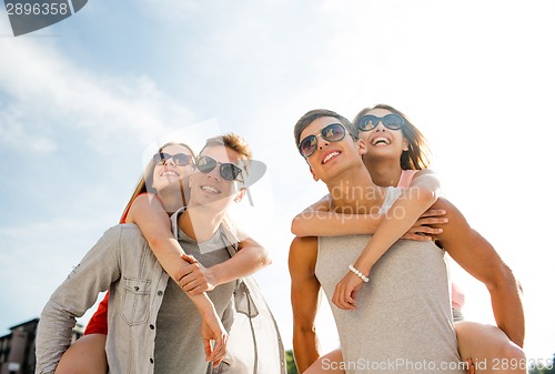 Image of smiling couple having fun in city