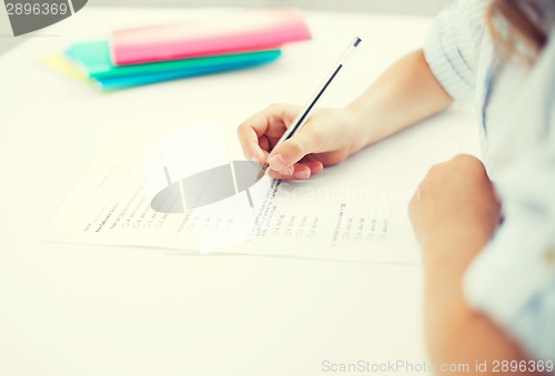 Image of little girl taking test