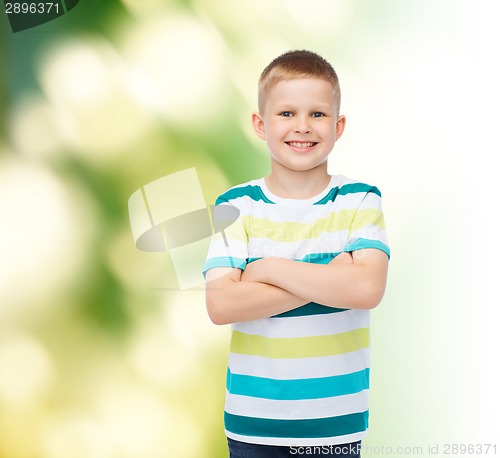 Image of little boy in casual clothes with arms crossed