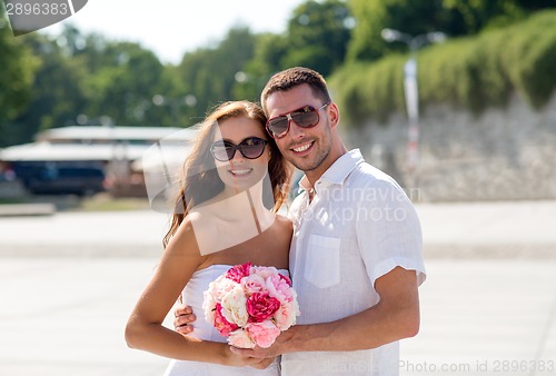 Image of smiling couple in city