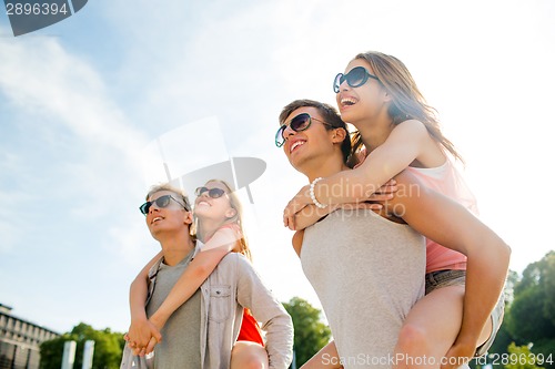 Image of smiling couple having fun in city