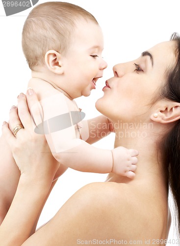 Image of happy mother kissing baby