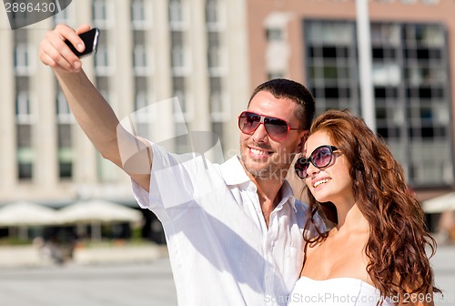 Image of smiling couple in city