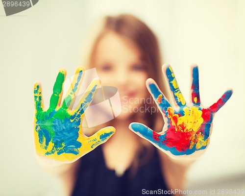 Image of girl showing painted hands