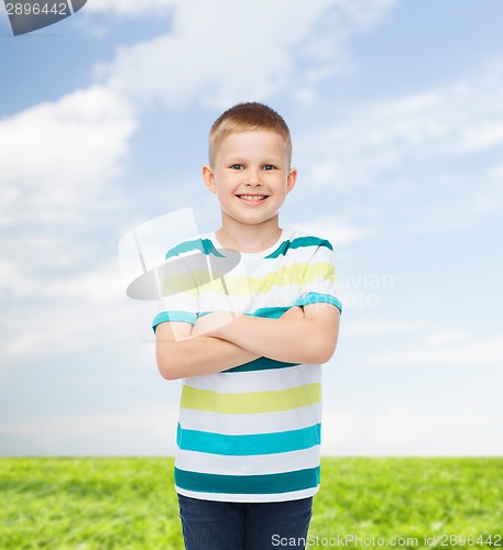 Image of little boy in casual clothes with arms crossed