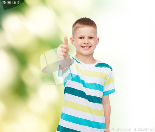 Image of little boy in casual clothes with arms crossed